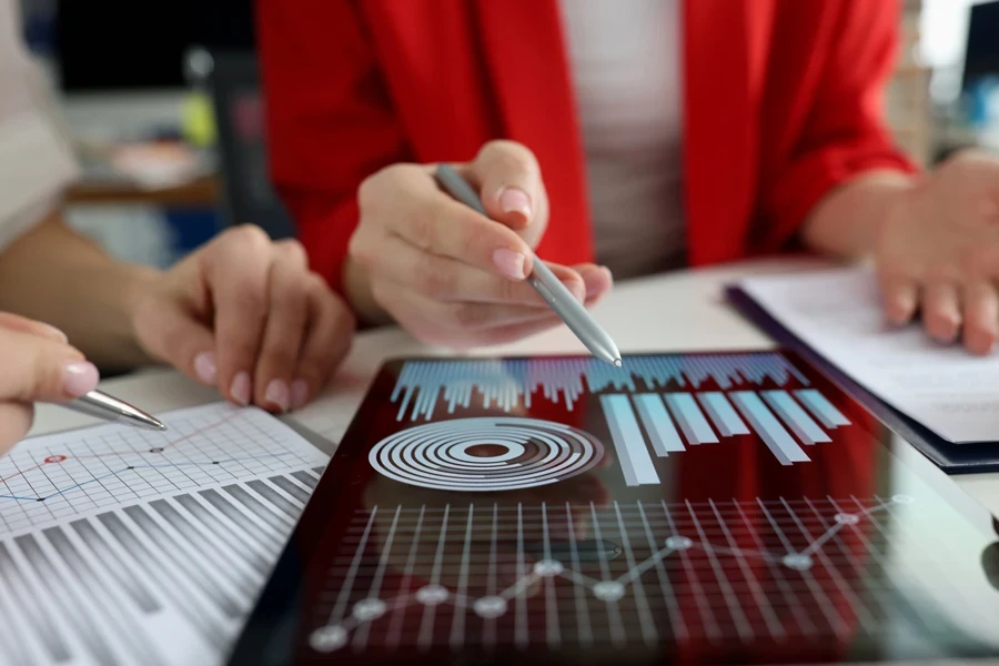 Businesswomen studying charts on a tablet