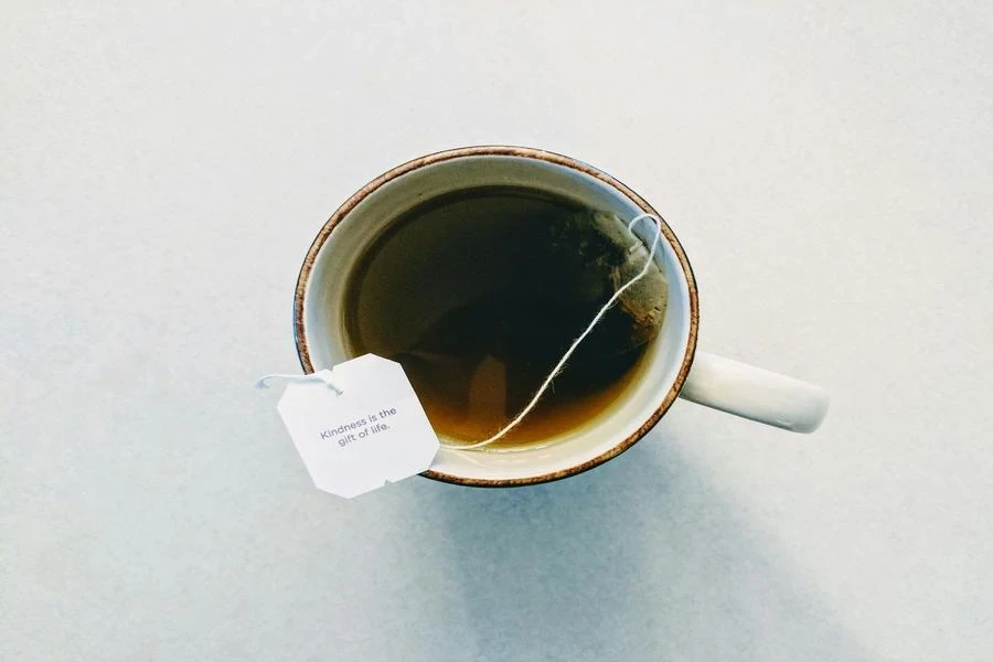 Ceramic mug with tea and tea bag