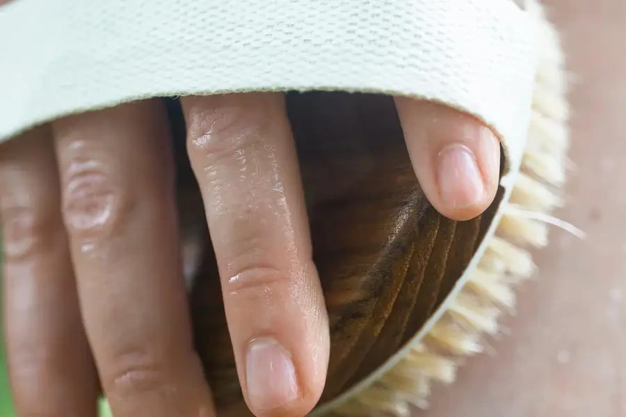 Close Up Of A Wooden Scrub Brush Exfoliating