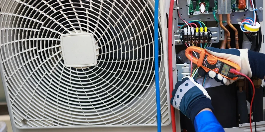 Close-up Air conditioner technician hand check fill refrigerant liquid