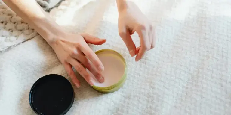 Close up of a Person Using a Cream by Karolina Kaboompics