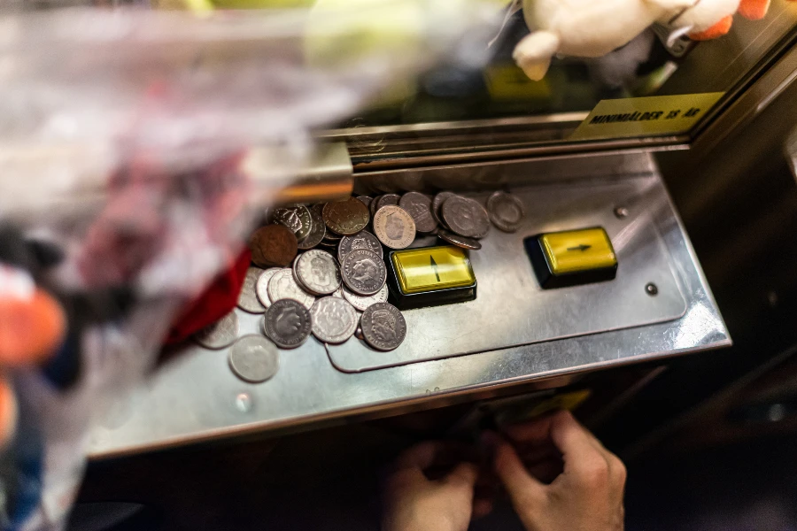 Coins and buttons on a coin machine