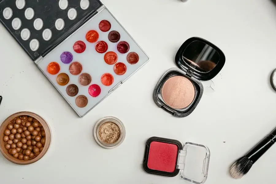 Color Palette Makeup Set on White Surface by MART PRODUCTION