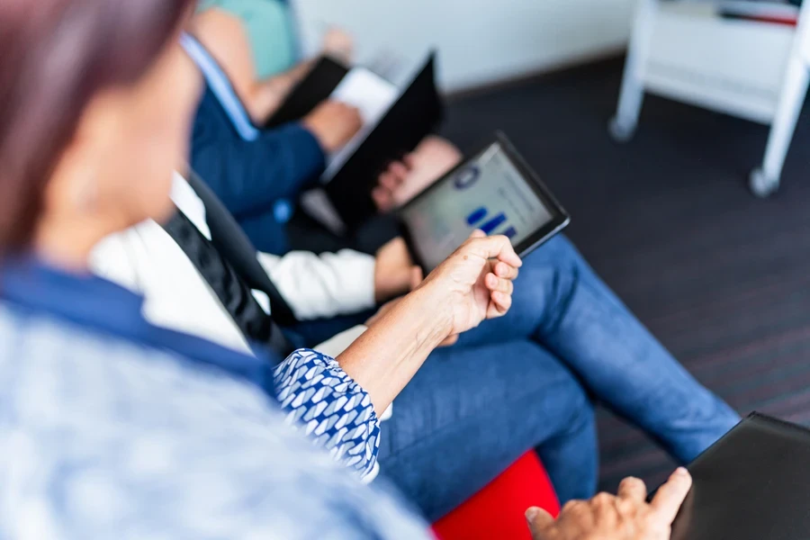 Coworkers looking at a graph on a tablet