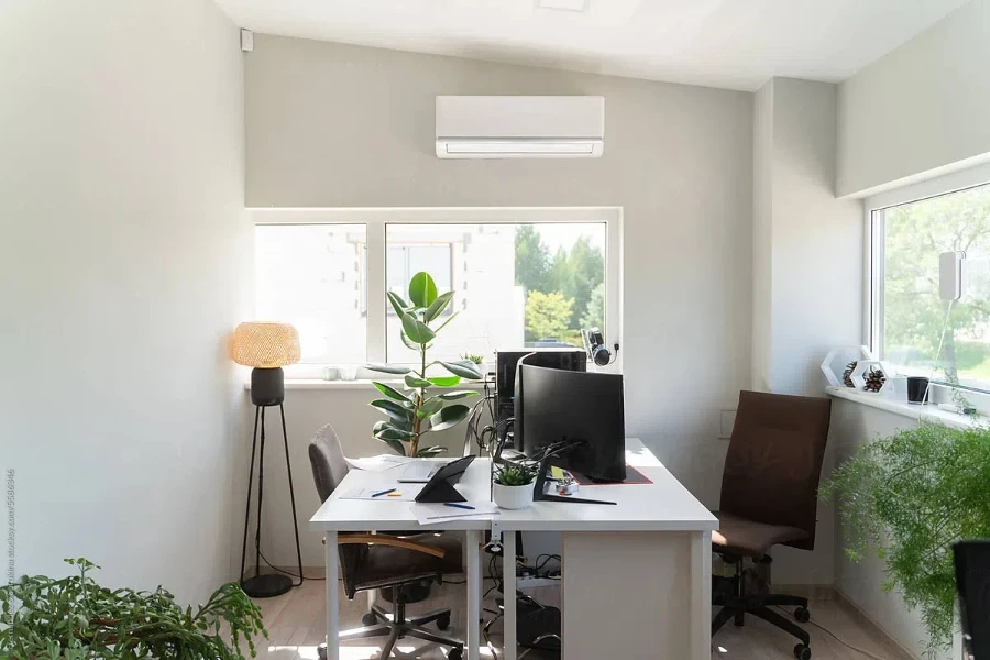 Cozy luminous workplace full of plants in bright office