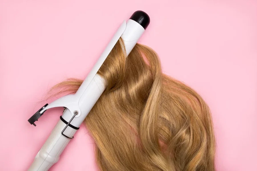 Curling blonde hair on a large diameter curling iron 