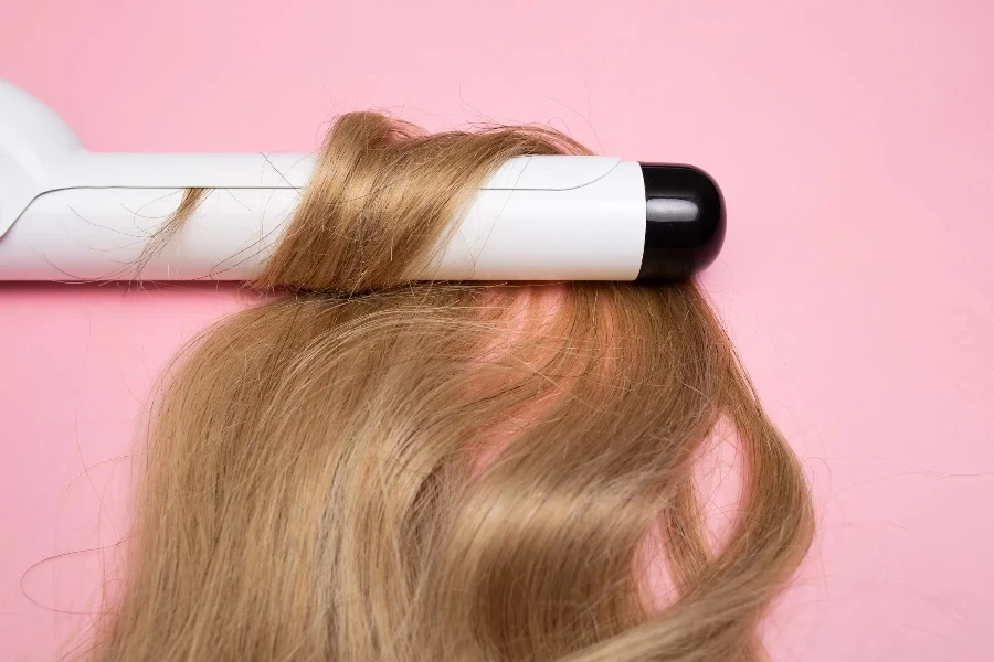 Curling blonde hair on a large diameter curling iron