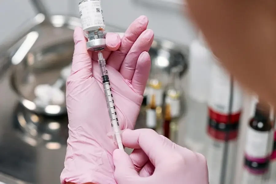 Doctor Inserting Syringe on an Ampoule by cottonbro studio