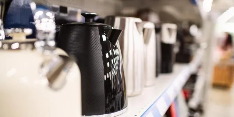 Electric kettles on a shelf for sale in a department store or showroom