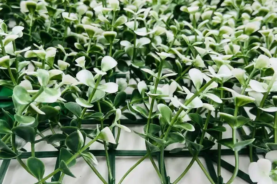 Fake plant wall with green foliage on frame