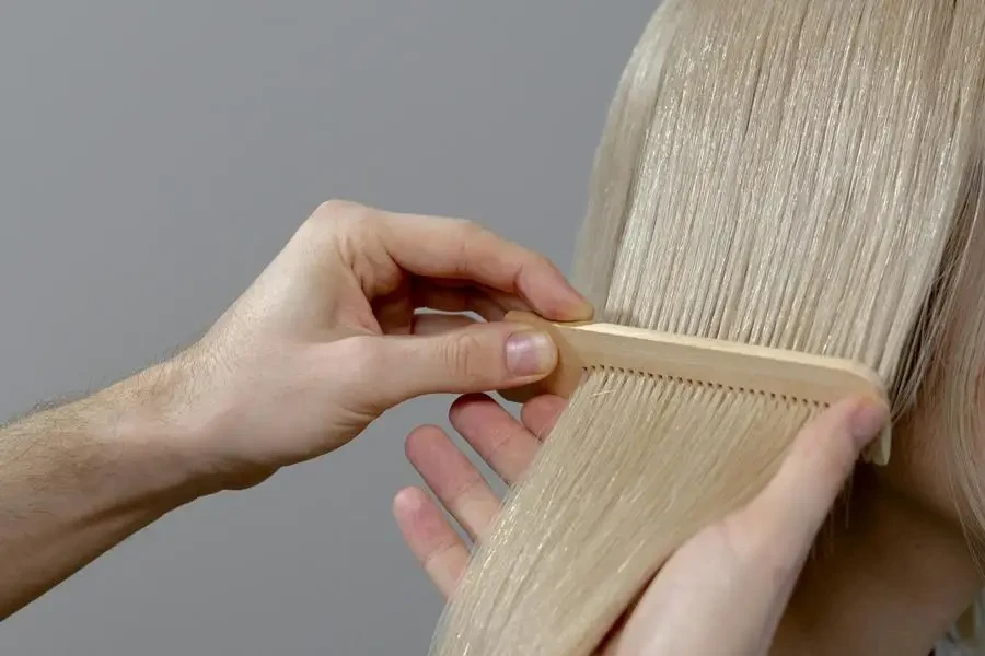 Hand Combing the Blonde Hair by cottonbro studio