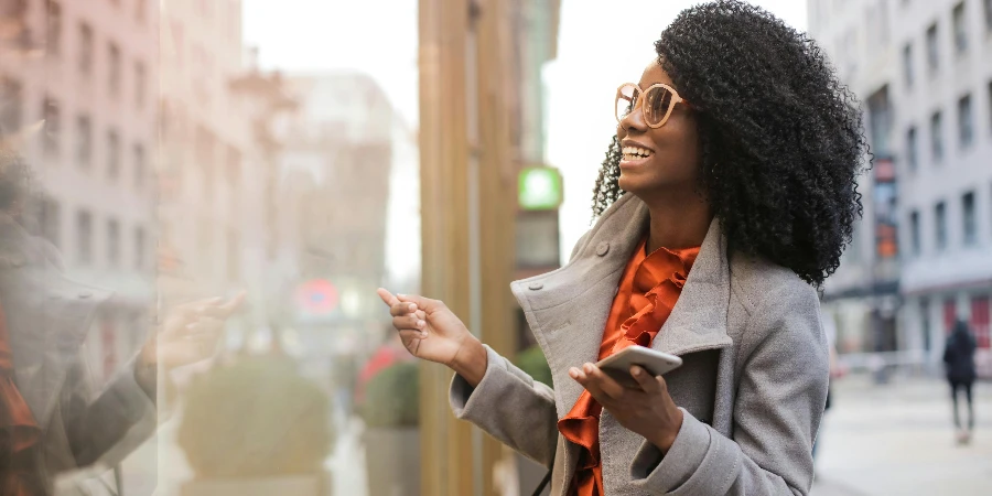 Happy black woman laughing on street