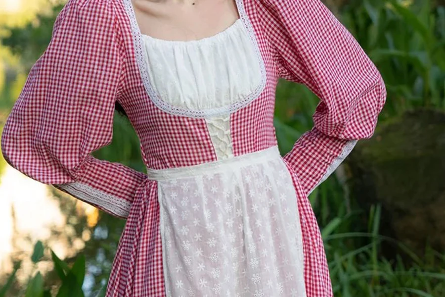 Lady posing in cottagecore dress with gingham prints