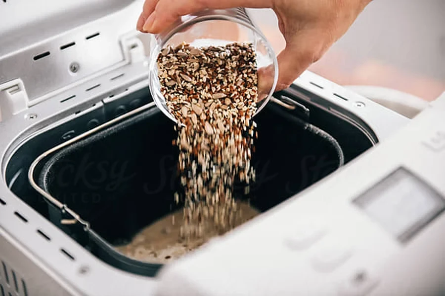 Making bread in a breadmaker by Pixel Stories on Stocksy (Stocksy Content License)