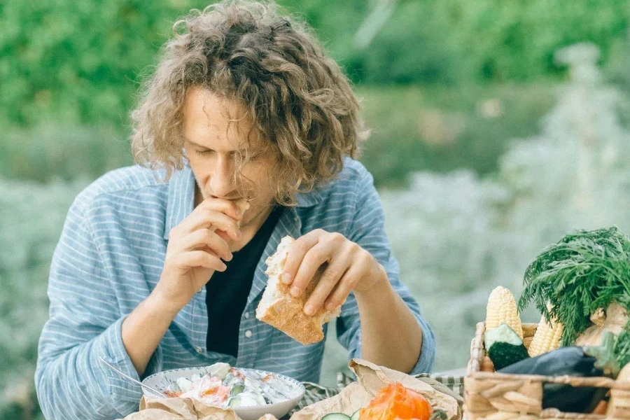 Man Eating a Piece of Bread