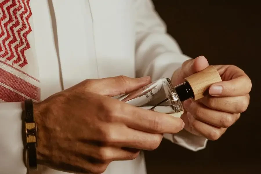 Man Hands Holding Perfume