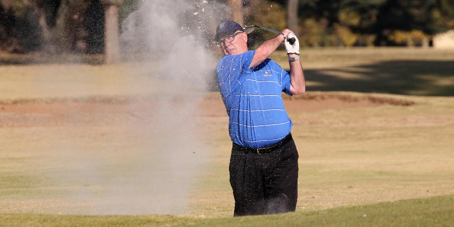 Man Hitting A Golf Ball