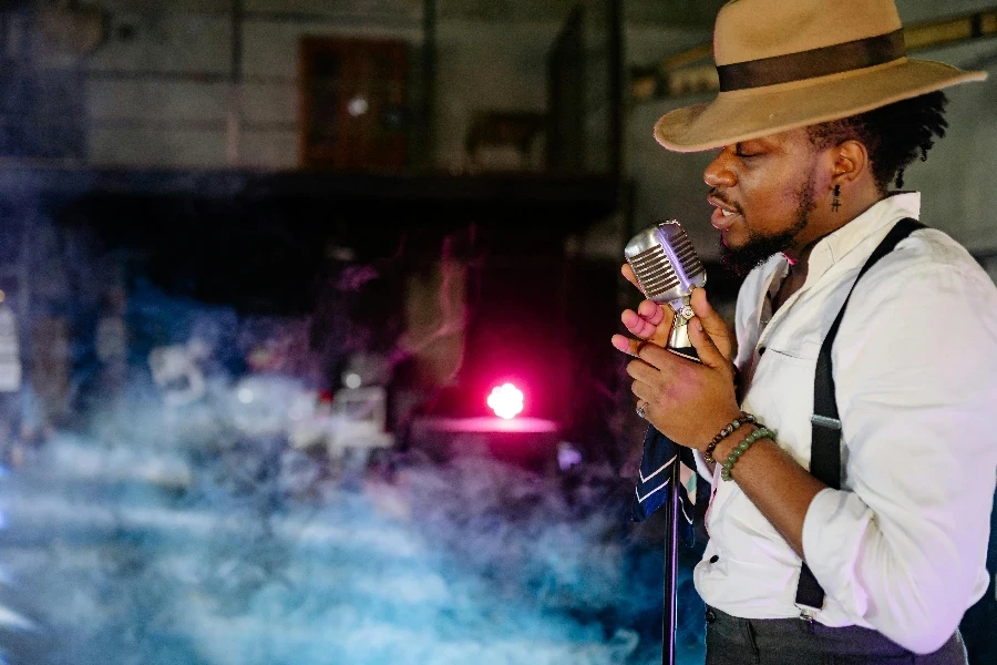 Man Holding Microphone Singing