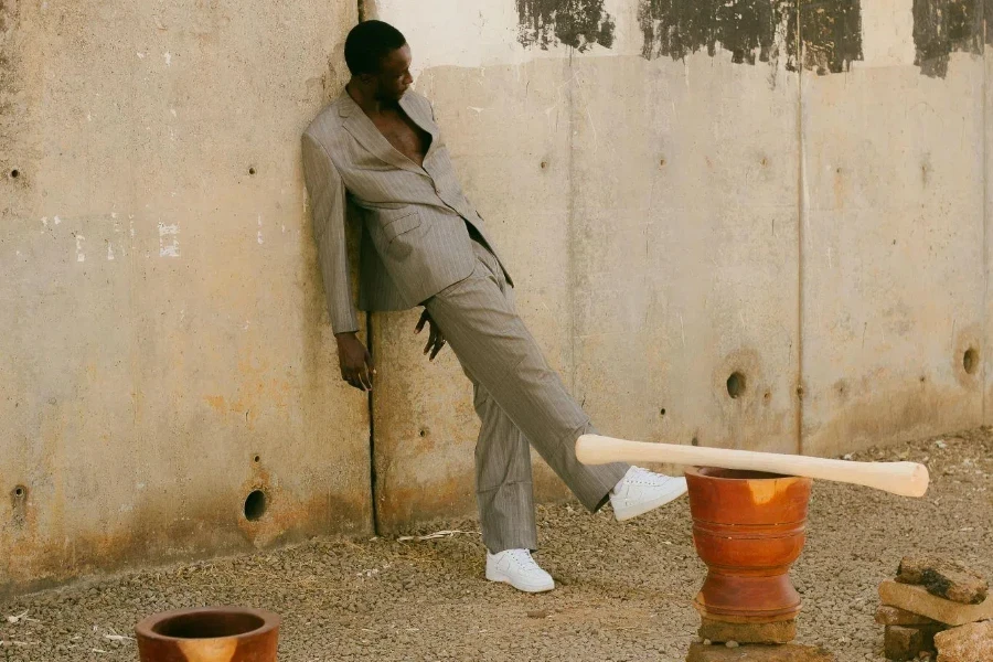 Man Posing in a Suit on a Dirt Road