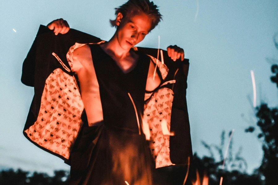 Man Standing Beside Bonfire