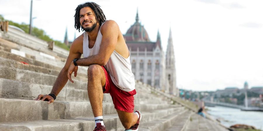 Man Stretching on Concrete Stairs