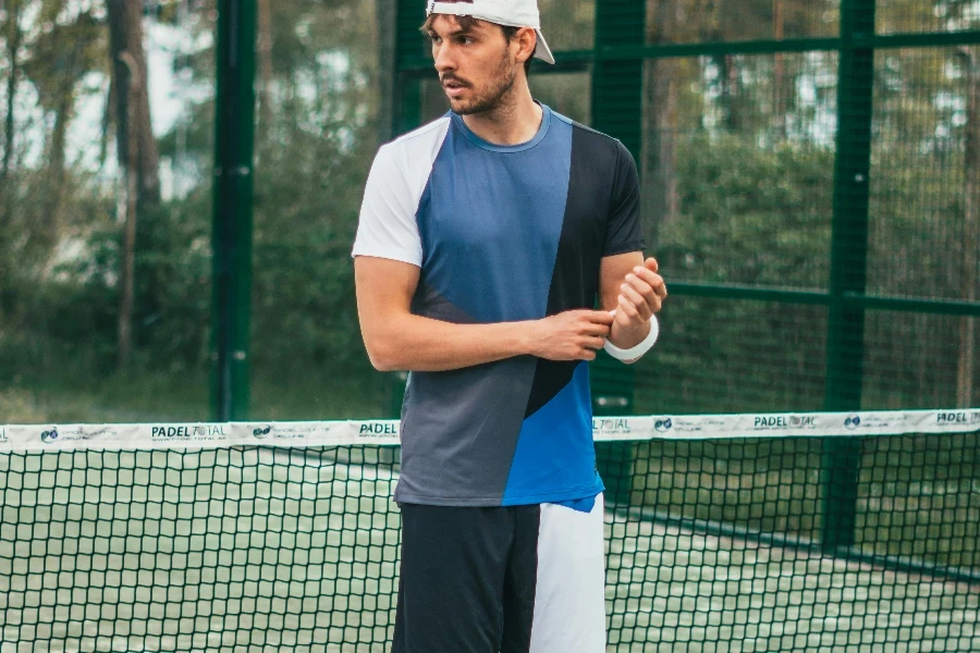 Man Wearing Blue and White Crew-neck Shirt and Shorts