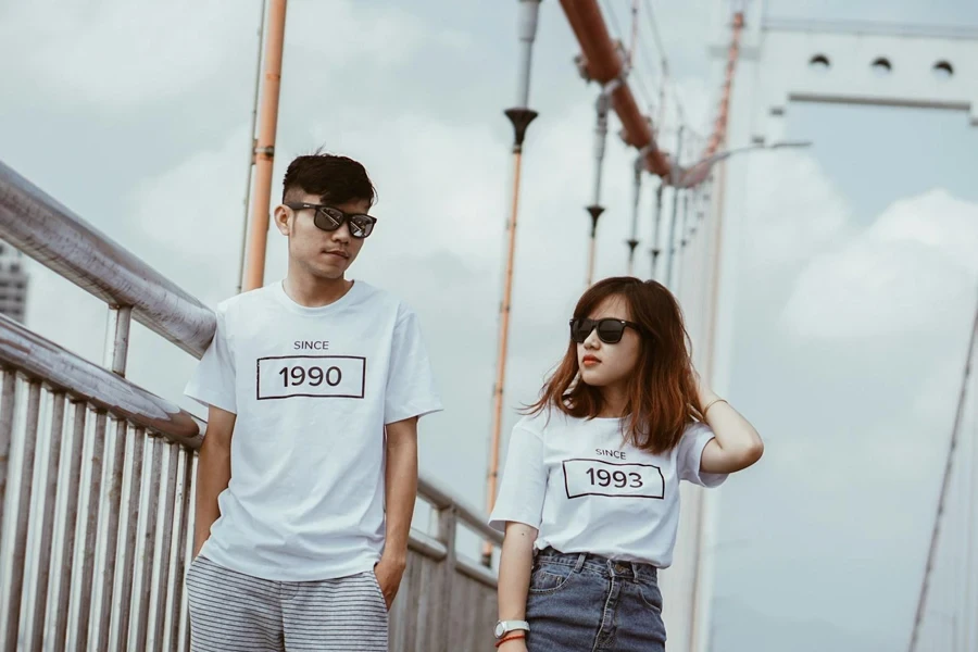 Man and woman with customized t-shirts