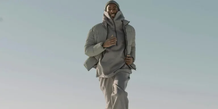 Man in Gray Jacket Running on Snow