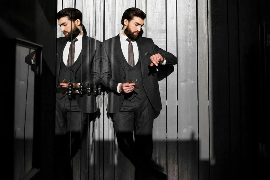 Man in Tuxedo Standing by Window