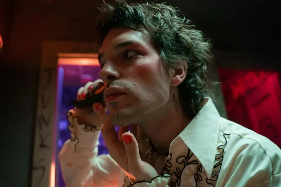 Man in a Costume Shaving His Stubble in a Bathroom in a Nightclub by cottonbro studio