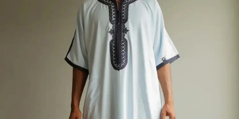 Man rocking a white thobe with interesting details
