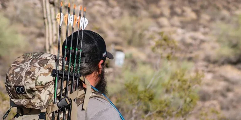 Man shooting with a quiver on his backpack
