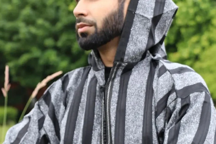 Man wearing a hooded and striped Kaftan