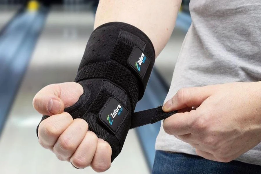 Man wearing wrist support in a bowling alley
