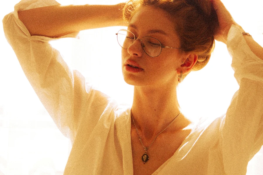 Model Wearing Eyeglasses and White Blouse