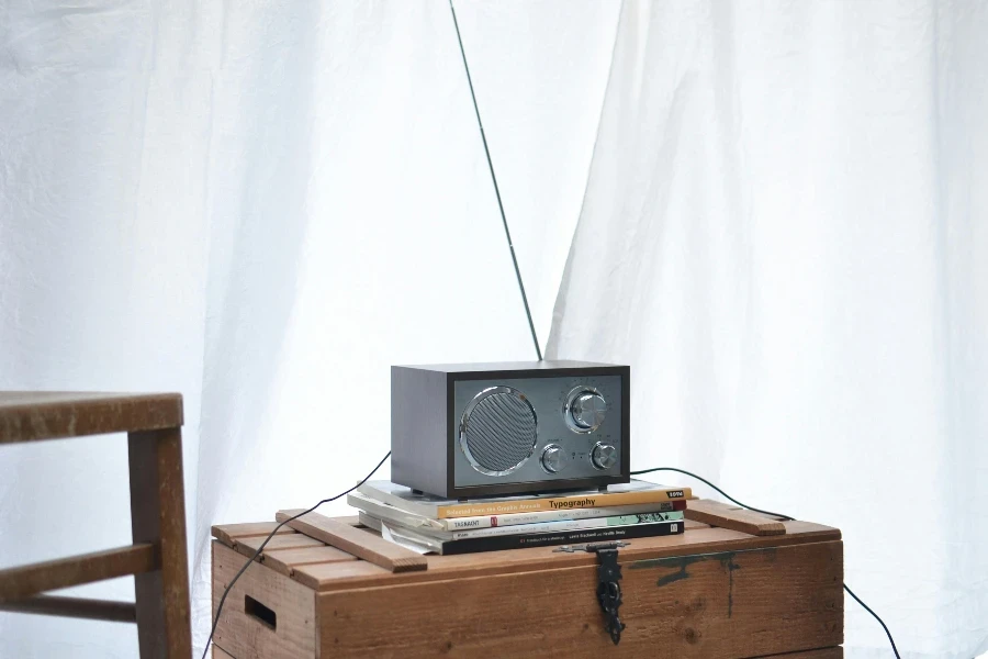 Modern radio set placed on wooden crate