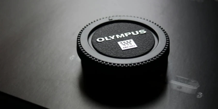 Olympus Camera Lens Cap Placed on Box