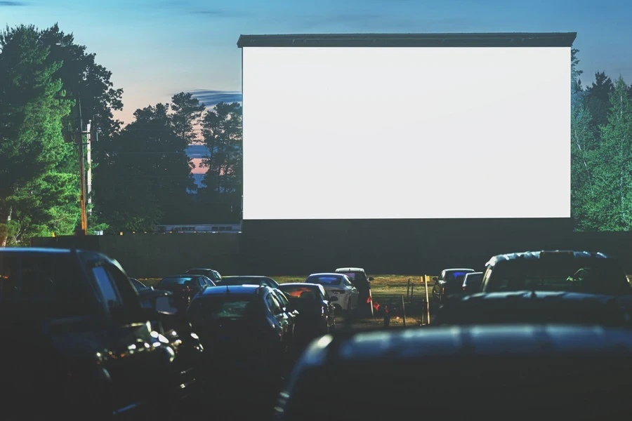 People enjoy a drive-in movie