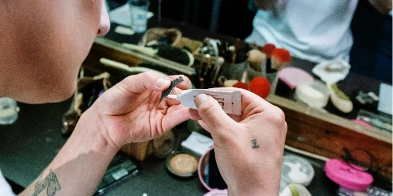Person Holding Fake Eyelashes