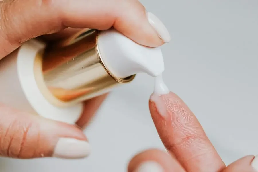 Person Holding White Plastic Bottle by Karolina Kaboompics