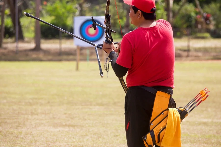 Person at a shooting range with a hip quiver