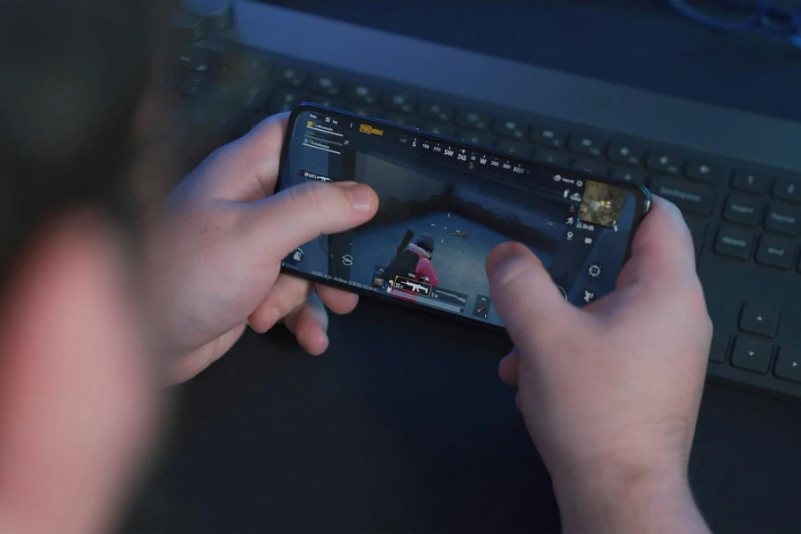 Person playing a mobile shooting game