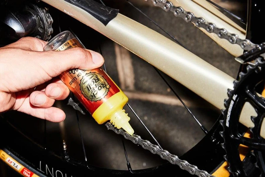 Person using lube from a drip bottle