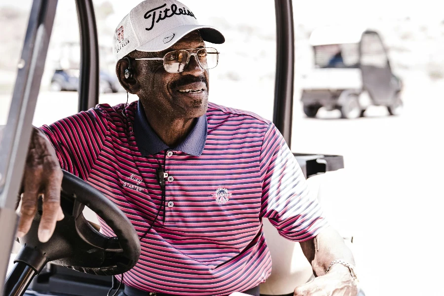 Photo of Man Sitting on Golf Cart