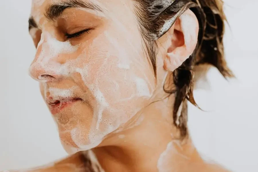 Portrait of Woman Taking Shower by Karolina Kaboompics