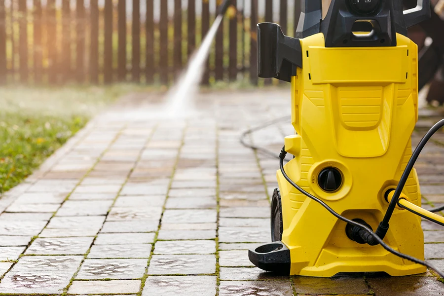 Pressure Cleaning with High Pressure Washer Karcher in Garden Park 