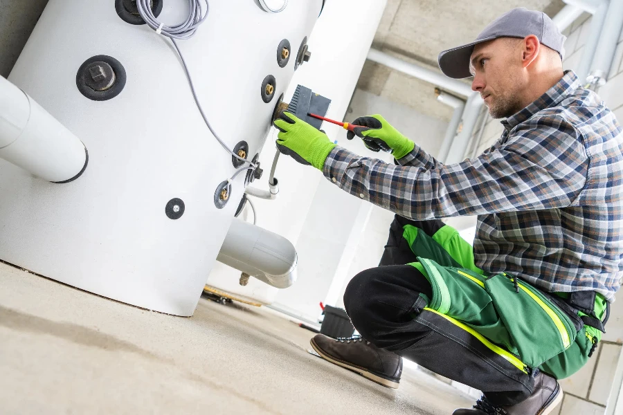 Professional HVAC Technician Contractor Finishing Hot Boiler Installation