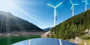 Renewable Energies Concept - Sunlight with solar panels. Wind with wind turbines. Rain and water with dam for hydropower