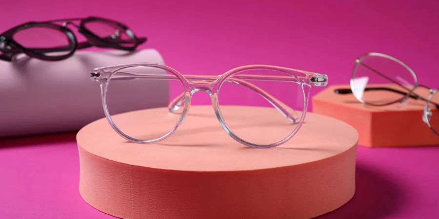 Stylish presentation of different glasses on pink background