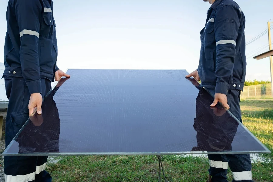 Technician is lifting the solar cell to replace the damaged one